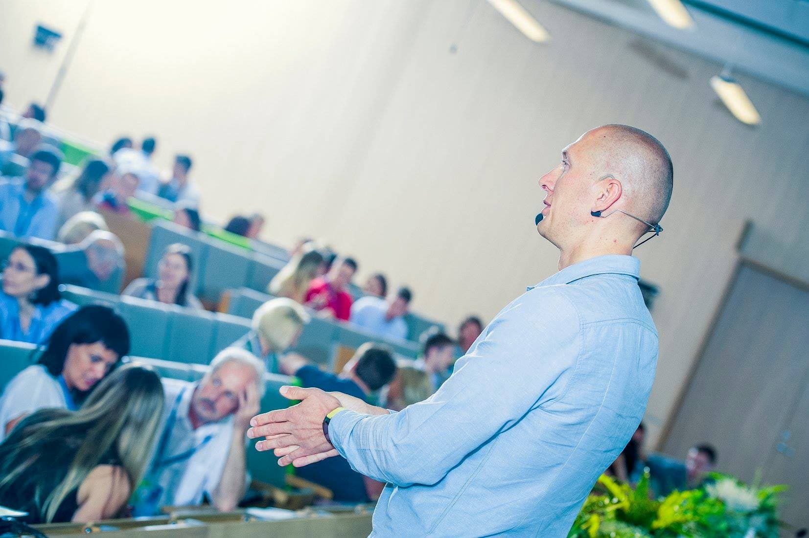 Egils Boitmanis speaking on stage